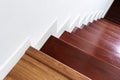 Hardwood stair steps and white wall, interior stairs material and home design Royalty Free Stock Photo