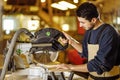 Hardworking carpenter using circular saw Royalty Free Stock Photo