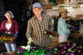 Farmers sort the recently harvested crop in the warehouse, putting it in crates Royalty Free Stock Photo