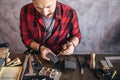 Hardworking goldsmith spending time in the workshop Royalty Free Stock Photo