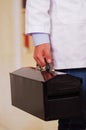 Hardworking Man holding a black tool box Royalty Free Stock Photo