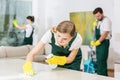 Hardworking young girl as a cleaner Royalty Free Stock Photo