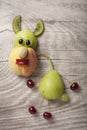 Rabbit made with fruits on wooden background