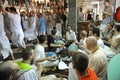 Hare Krishna parishioners dancing in a temple, musicians playing on Indian musical instruments