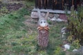 Hare made from logs and cones is in the yard