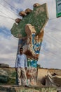 HARGEISA, SOMALILAND - APRIL 15, 2019: Local man at the Somaliland Indepedence Monument shaped as the country in