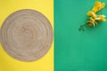 Hari Raya Aidilfitri table setting with traditional table mat and dinnerware with green and yellow background. Royalty Free Stock Photo