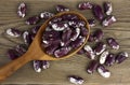 Haricot beans in a wooden spoon on wooden background Royalty Free Stock Photo