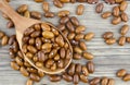 Haricot beans in a wooden spoon on wooden background Royalty Free Stock Photo