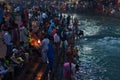 Haridwar, India - March 20, 2017: Holy ghats at Haridwar, India, sacred town for Hindu religion. Pilgrims offering floating flowe Royalty Free Stock Photo