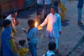 Haridwar, India - March 20, 2017: Holy ghats at Haridwar, India, sacred town for Hindu religion. Pilgrims offering floating flowe Royalty Free Stock Photo