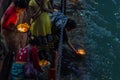 Haridwar, India - March 20, 2017: Holy ghats at Haridwar, India, sacred town for Hindu religion. Pilgrims offering floating flowe Royalty Free Stock Photo