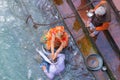 Haridwar, India - March 11, 2017: unidentified people bathing and taking ablutions in the Ganges River at the Holy ghats in Haridw Royalty Free Stock Photo