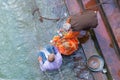 Haridwar, India - March 11, 2017: unidentified people bathing and taking ablutions in the Ganges River at the Holy ghats in Royalty Free Stock Photo