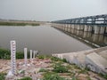 Hydro electric check dam on bank of a river, north india, flood gates Royalty Free Stock Photo