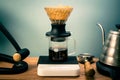 Hario V60 Immersion Dripper preparing coffee on the blurred background Royalty Free Stock Photo