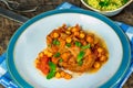 Harissa lamb chops with chickpeas and minted couscous Royalty Free Stock Photo