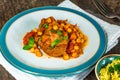 Harissa lamb chops with chickpeas and minted couscous Royalty Free Stock Photo