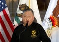 Harlan Wong speaking at a Press Conference at City Hall for the annual unveiling of the commemorative Lunar New Year Stamp