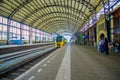 Harlem, Amsterdam, Netherlands - July 14, 2015: Inside railroad station, large roof covering platform, blue and yellow Royalty Free Stock Photo