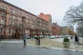 Harlem Neighborhood on a Rainy Day. A Couple of Tourists Try to Decide Which Way to Go. Typical Harlem Buildings and a Crossroad