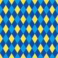 Seamless harlequin pattern background in blue and yellow.