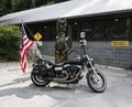 Harley Davidson bike in front of Tail of the Dragon statue