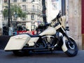 A Harley Davidson motorbike in front a store in Paris