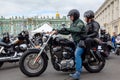 Harley-Davidson Motorcycle Festival - A couple of bikers in helmets rides along Palace Square on a motorcycle