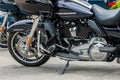 2022 Harley-Davidson Road Glide Limited Motorcycle on asphalt parking at spring day - close side view on engine Royalty Free Stock Photo