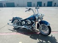 Harley Davidson Softail with fat spoke rims parking in a parking lot Royalty Free Stock Photo