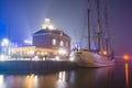 Harlingen, Netherlands - January 09, 2020. Port of Harlingen in fog at night