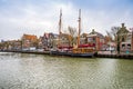 Harlingen, Nethrelands - January 10, 2020. Boats in water canal in downtown in winter