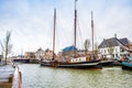 Harlingen, Nethrelands - January 10, 2020. Boats in water canal in downtown in winter