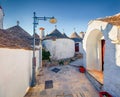 ÃÂ¡harm of the ancient cities of Europe. Splendid morning view of empty strret with trullo trulli