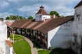 Harman Fortified Church, Transylvania, Romania: medieval Saxon houses for shelter when under attack Royalty Free Stock Photo