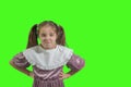 Harmful bad girl. Green screen. disgruntled little girl wearing retro dress. irritated face expressions show negative attitude