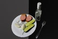 Harmful food the concept of alcoholism on a white plate is a glass of vodka and a snack