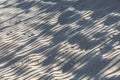 Harmonic pattern of shadow at the sandy beach