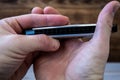 Harmonica in the hands of a man Royalty Free Stock Photo