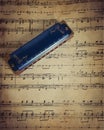 Harmonica and sheet music Royalty Free Stock Photo