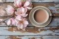 A harmonious blend of soft pink magnolias and a comforting cup of cafe au lait Royalty Free Stock Photo