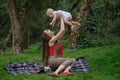 Harmonious family outdoors. Happy loving mother and her baby. Mom playing with child Royalty Free Stock Photo