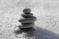 Harmony and balance, cairns, simple poise stones on white background, rock zen sculpture, white pebbles, single tower, simplicity Royalty Free Stock Photo