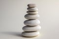 Harmony and balance, cairns, simple poise stones on white background, rock zen sculpture, white pebbles, single tower, simplicit