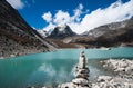 Harmony and balance: Pebble stack and Sacred Lake in Himalayas