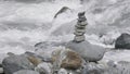 Harmony, balance and simplicity concept. Creative. A stone pyramid on the background of river water. Royalty Free Stock Photo