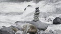 Harmony, balance and simplicity concept. Creative. A stone pyramid on the background of river water. Royalty Free Stock Photo