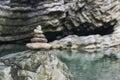 Harmony, balance and simplicity concept. A stone pyramid on the background of river water. Simple poise pebbles, rock zen Royalty Free Stock Photo