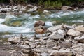 Harmony, balance and simplicity concept. A stone pyramid with a river in the background Royalty Free Stock Photo
